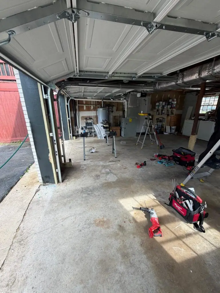 Newly installed garage door and track system in a residential garage