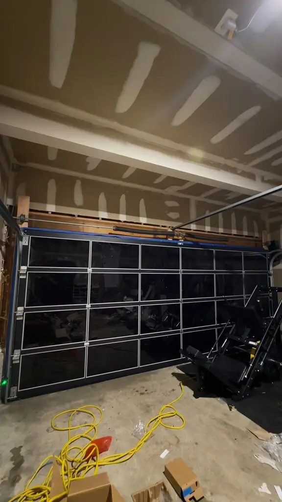Modern full-view glass garage door installed by American Shield