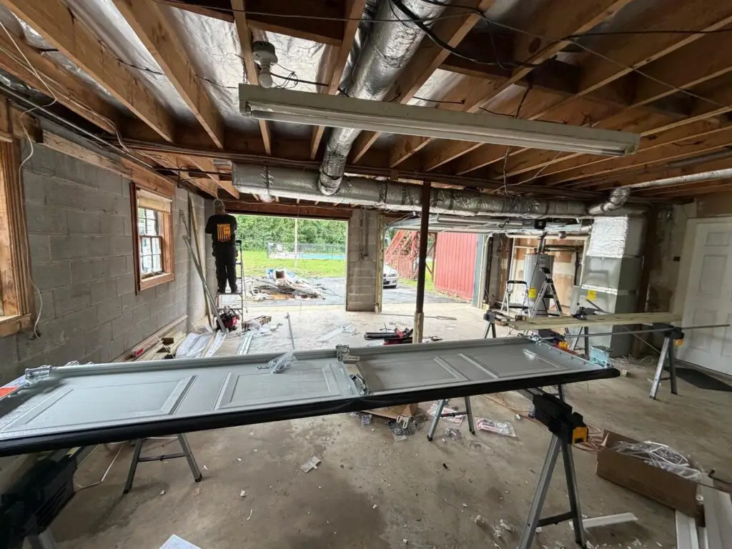 New garage door panels staged for installation